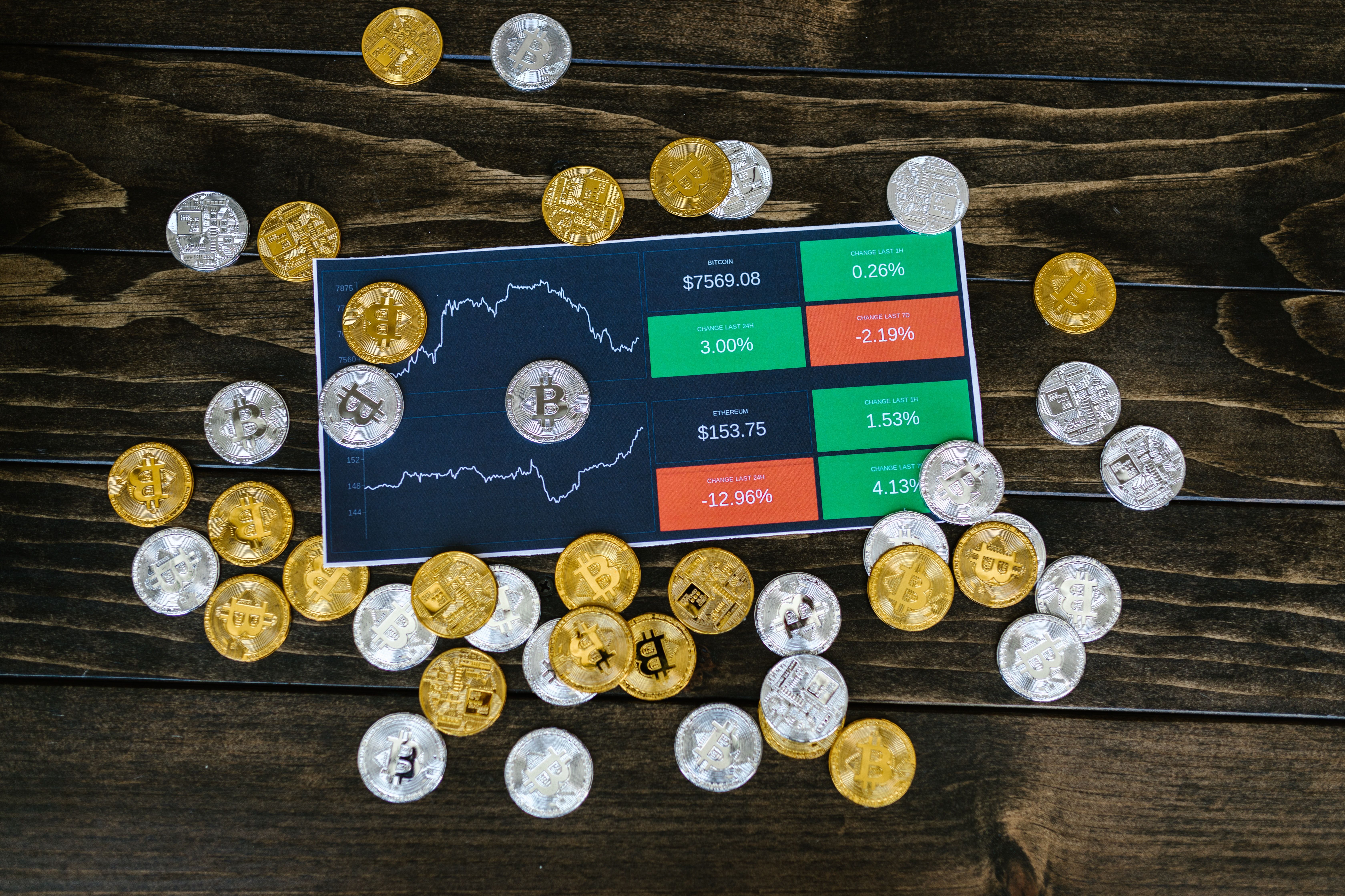 cryptocurrency coins scattered on table