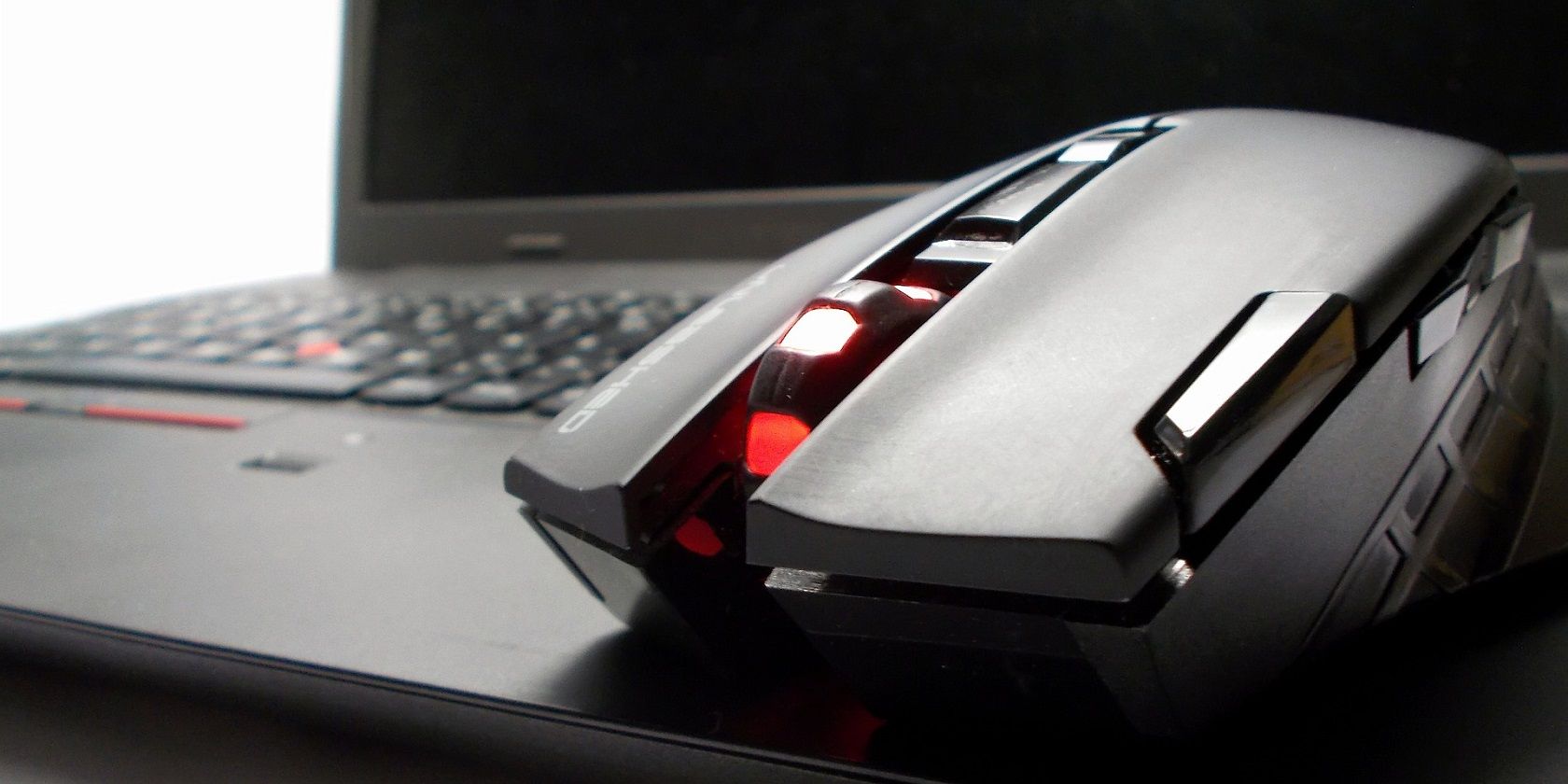 a close up of a pc mouse on laptop