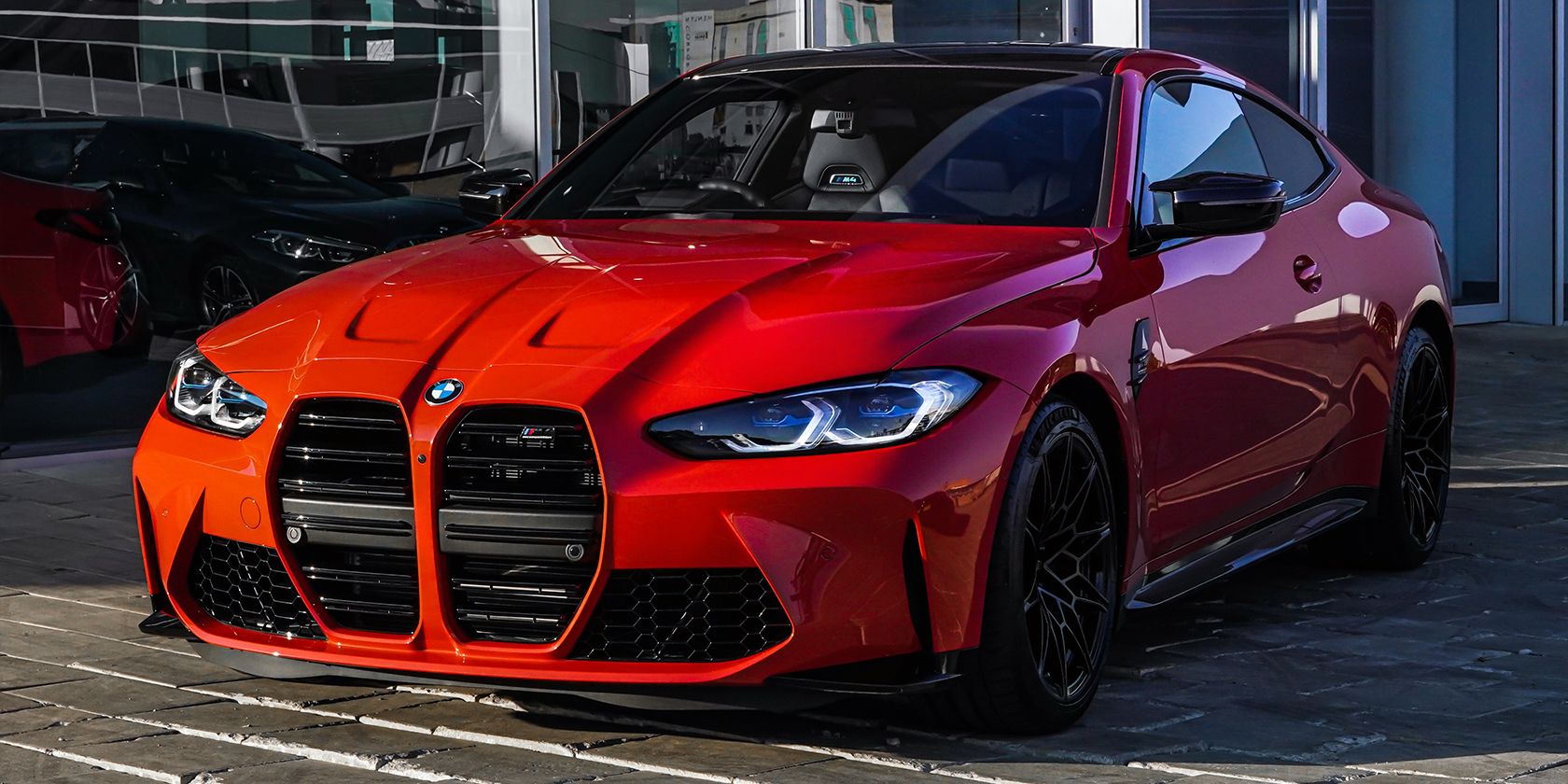 A 2021 BMW M4 in Toronto Red Metallic Color