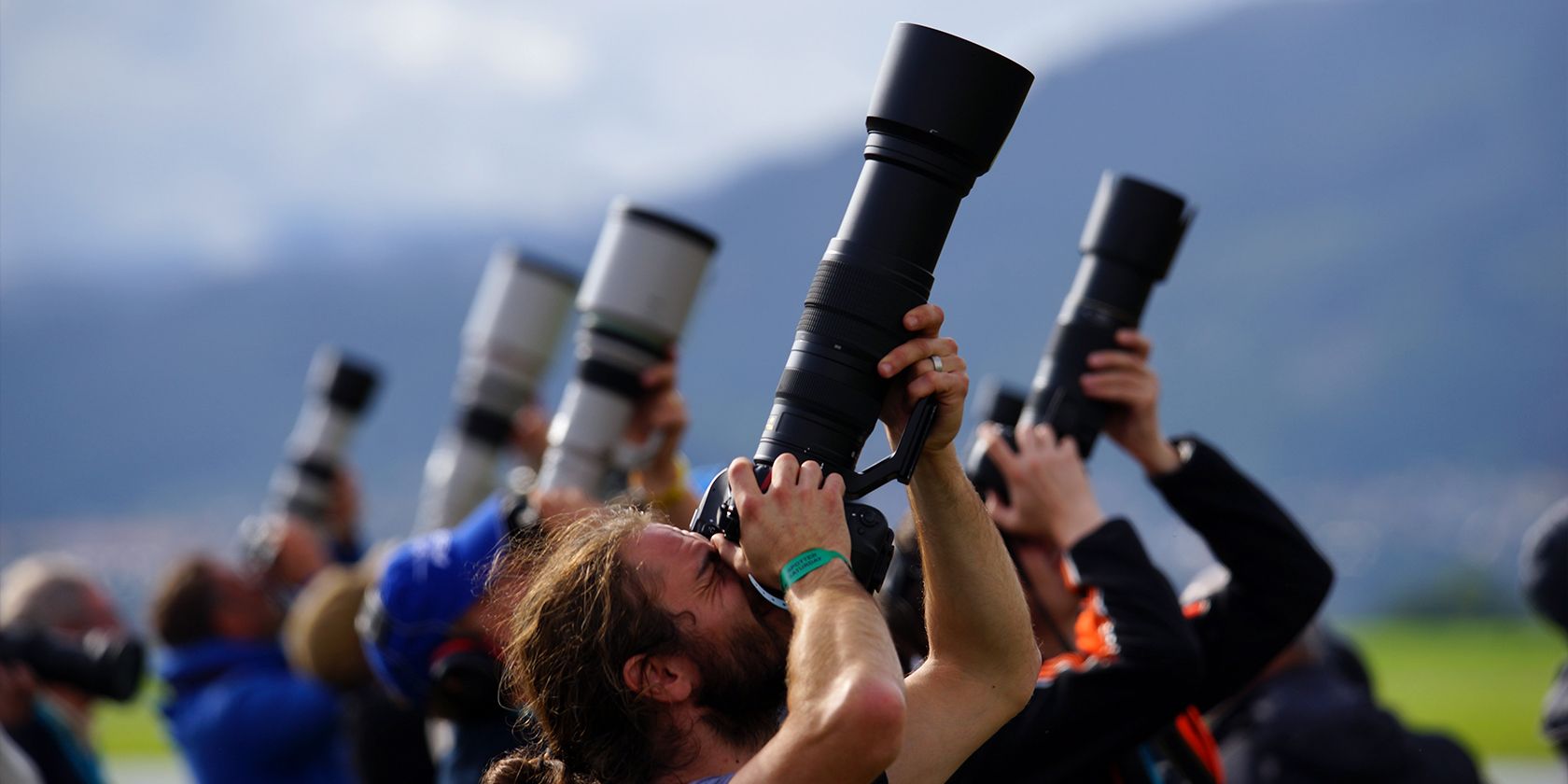 A group of photographers using long lenses