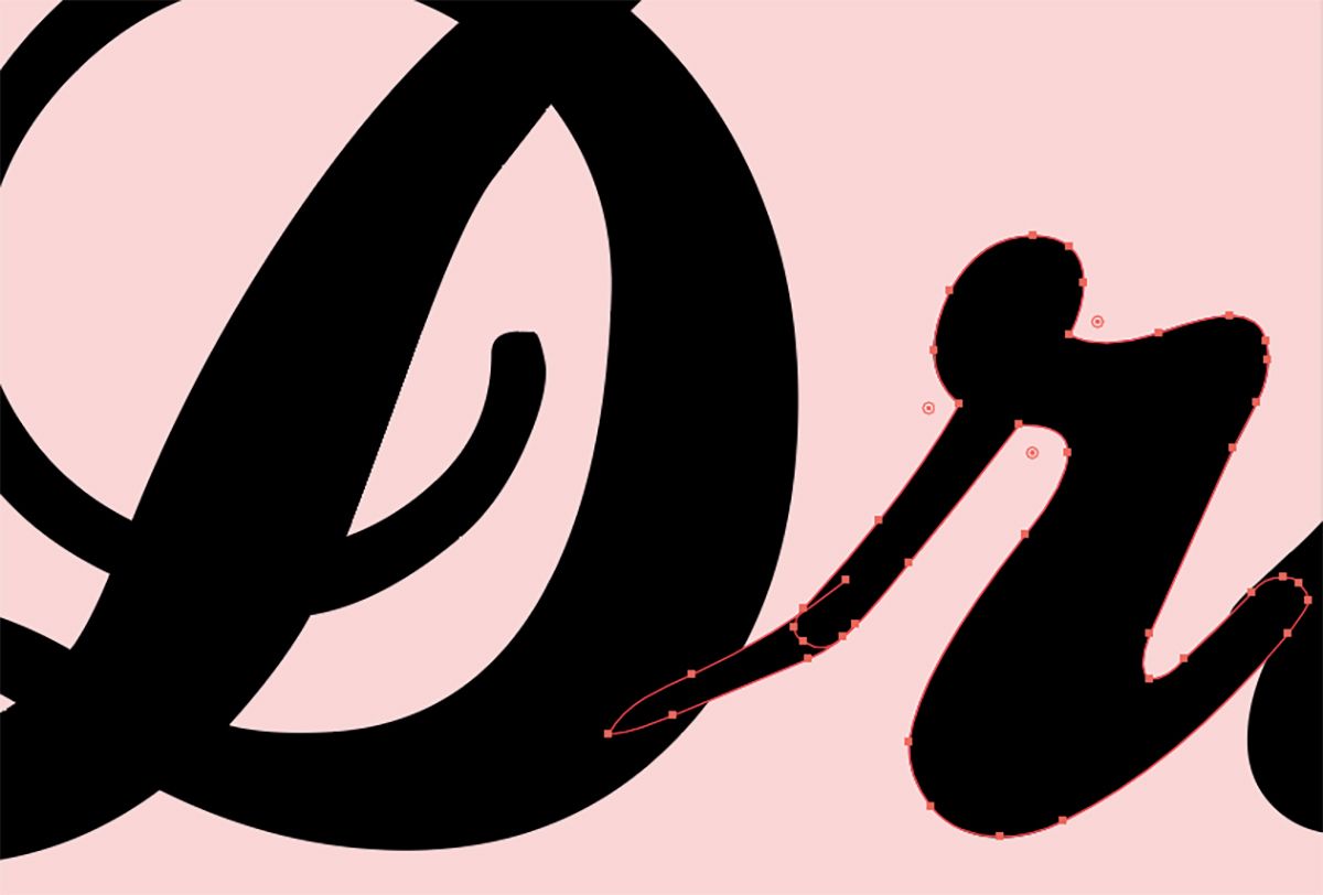 Zoomed in black text of "D" and "r" on a pink background.