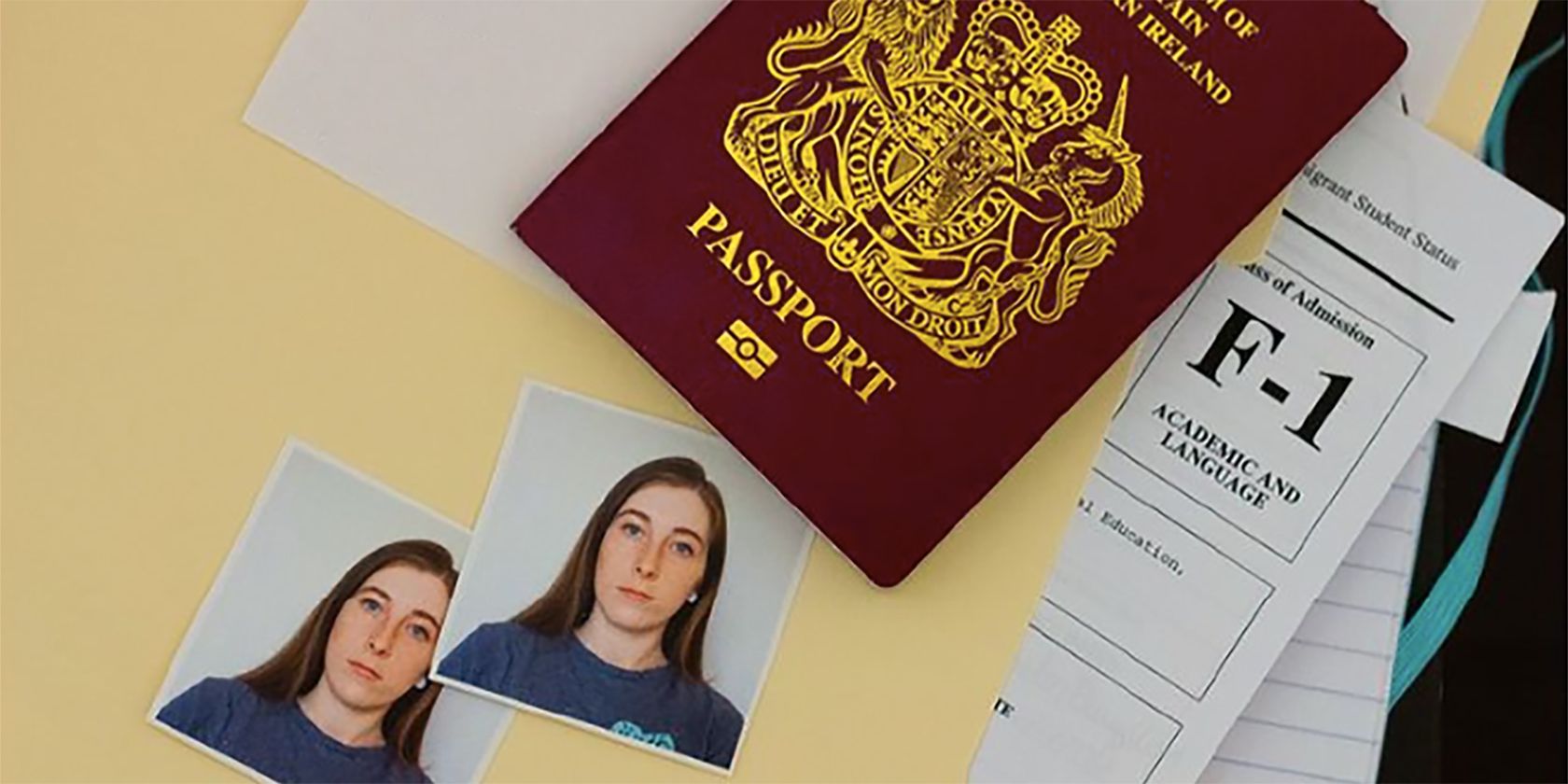 British passport with two printed photos of woman next to it.