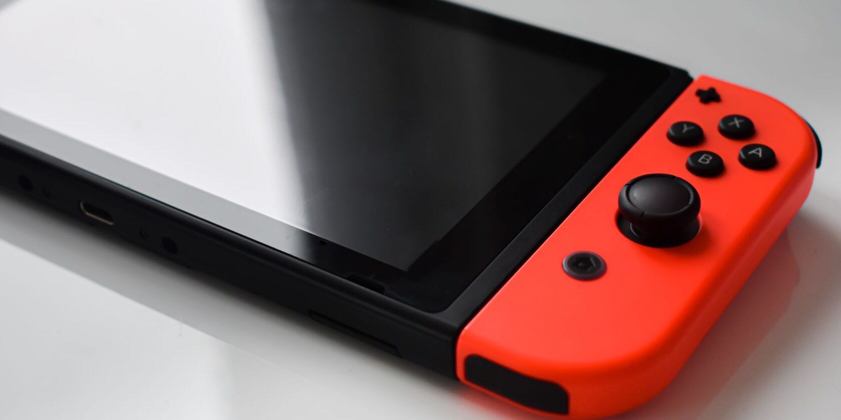 A picture of a Nintendo Switch with red Joy Cons 