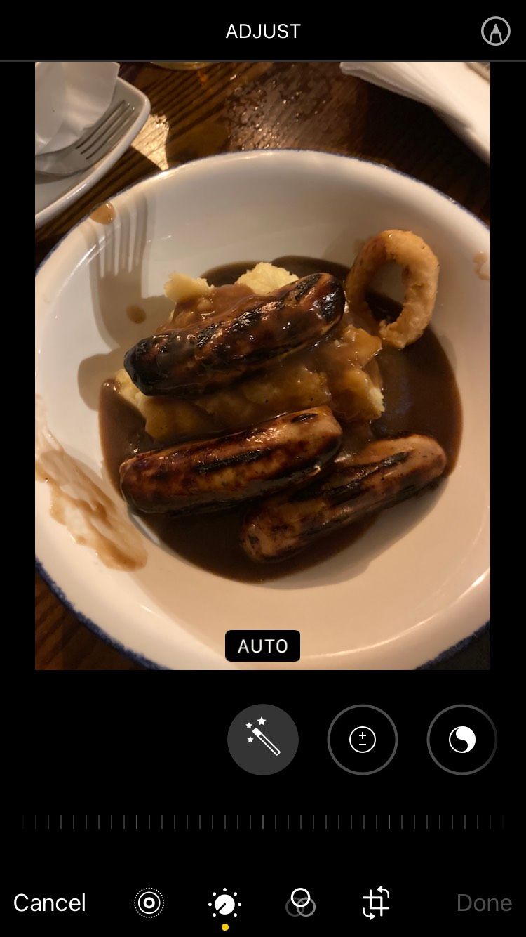 An image of sausage and mash opened on the Apple Photos iOS app