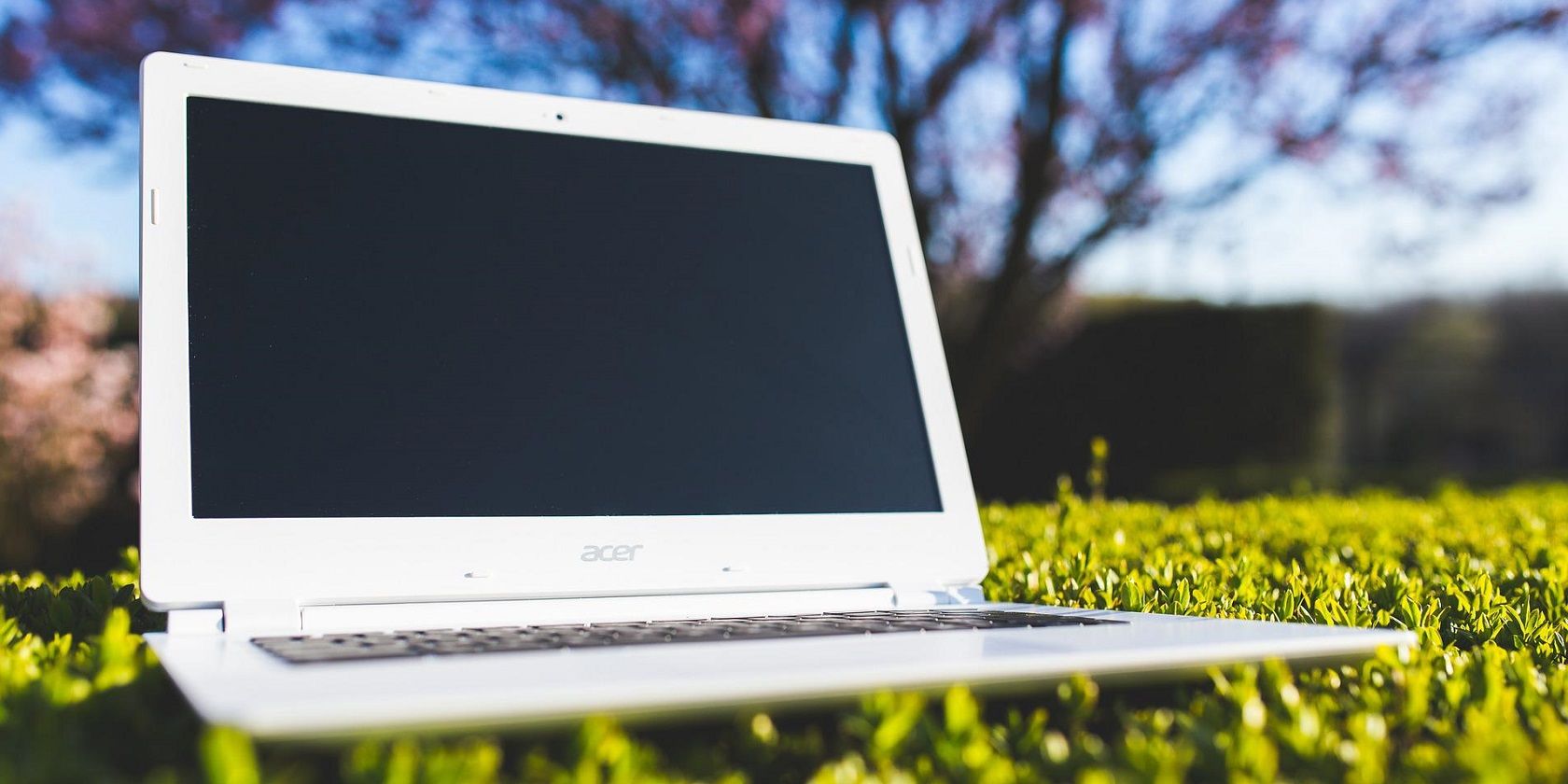 Image of laptop on grass outside