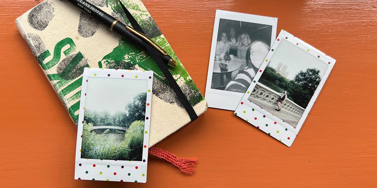 Journal with 3 instax photos next to it.