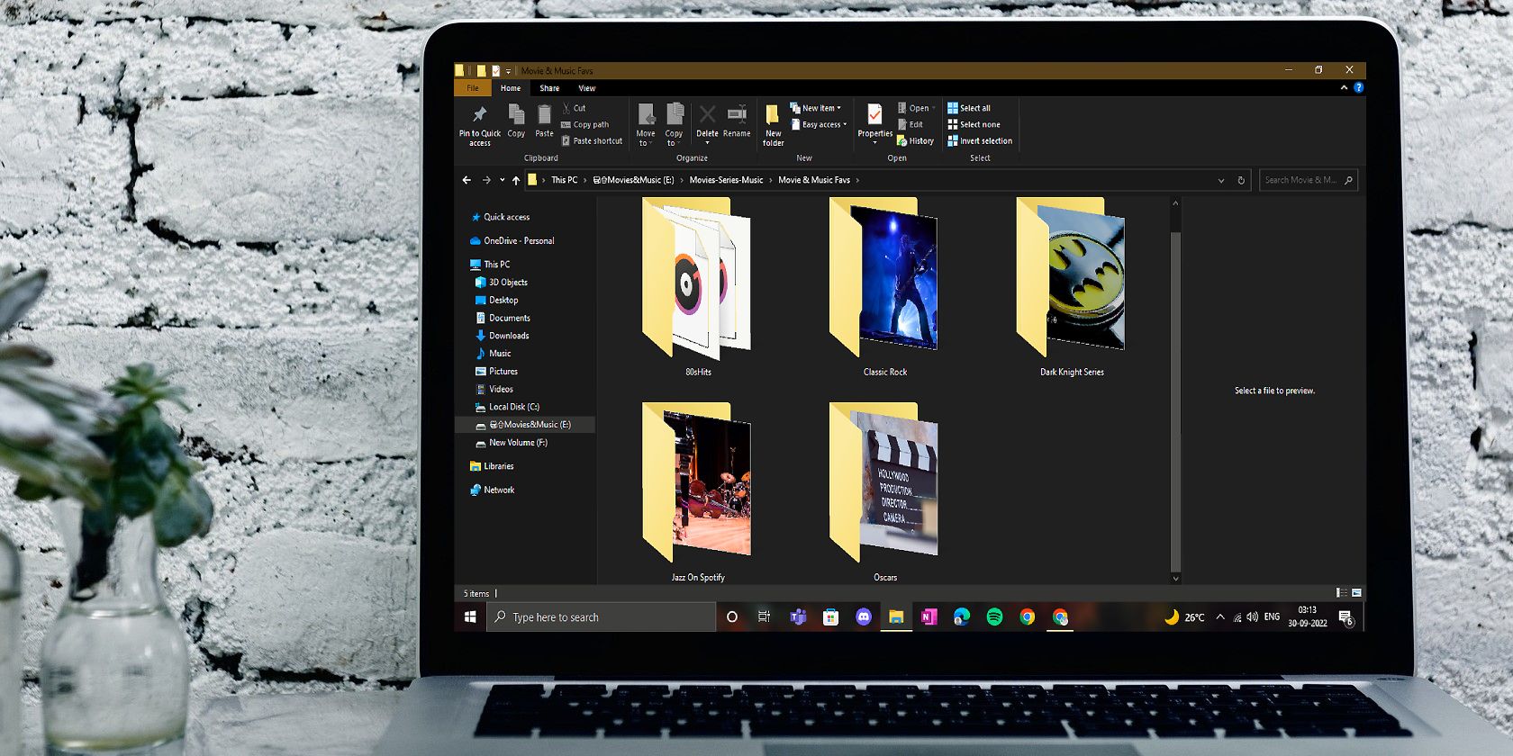 Windows Laptop Screen Showing Folders With Different Pictures