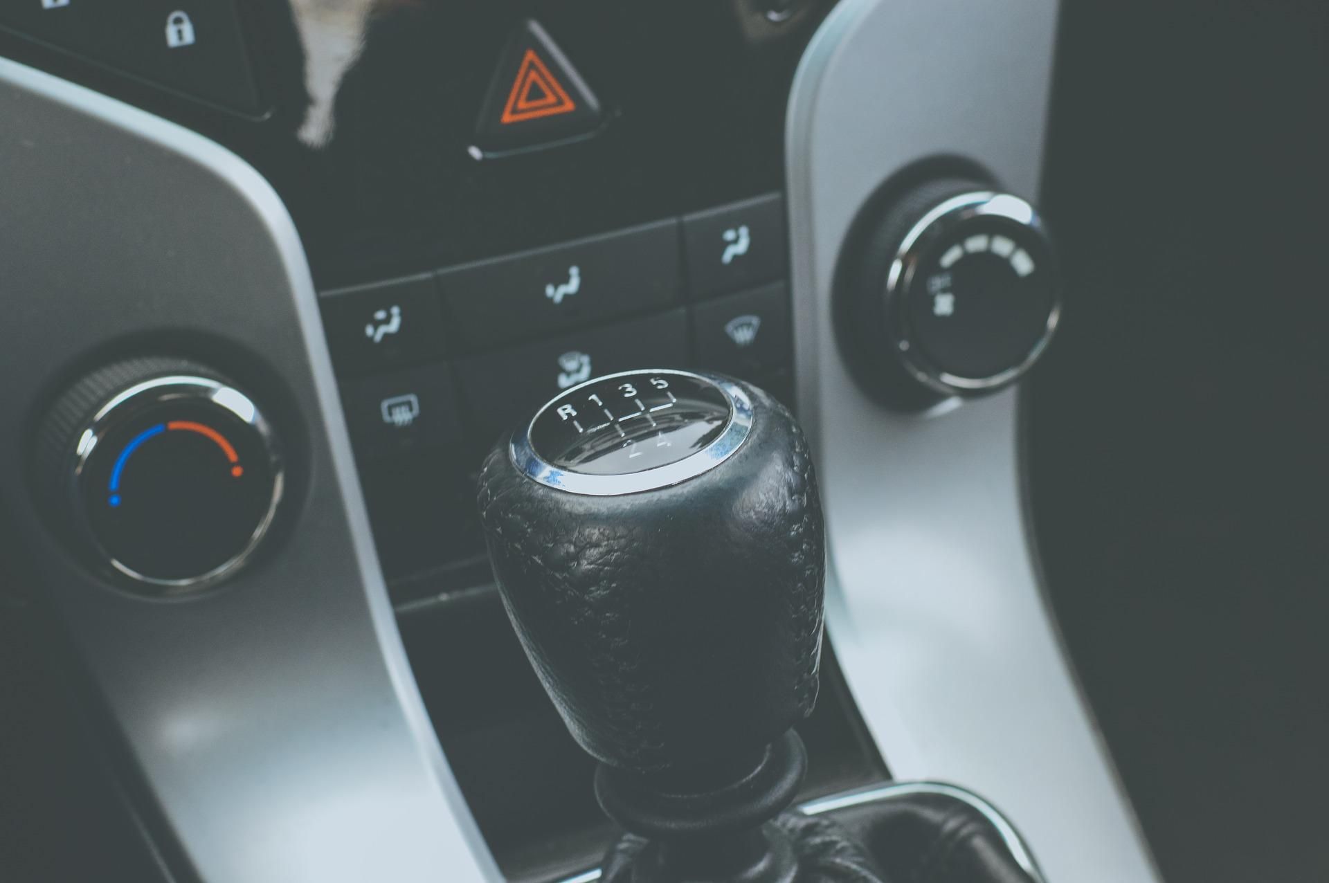A close-up of a manual transmission shift knob