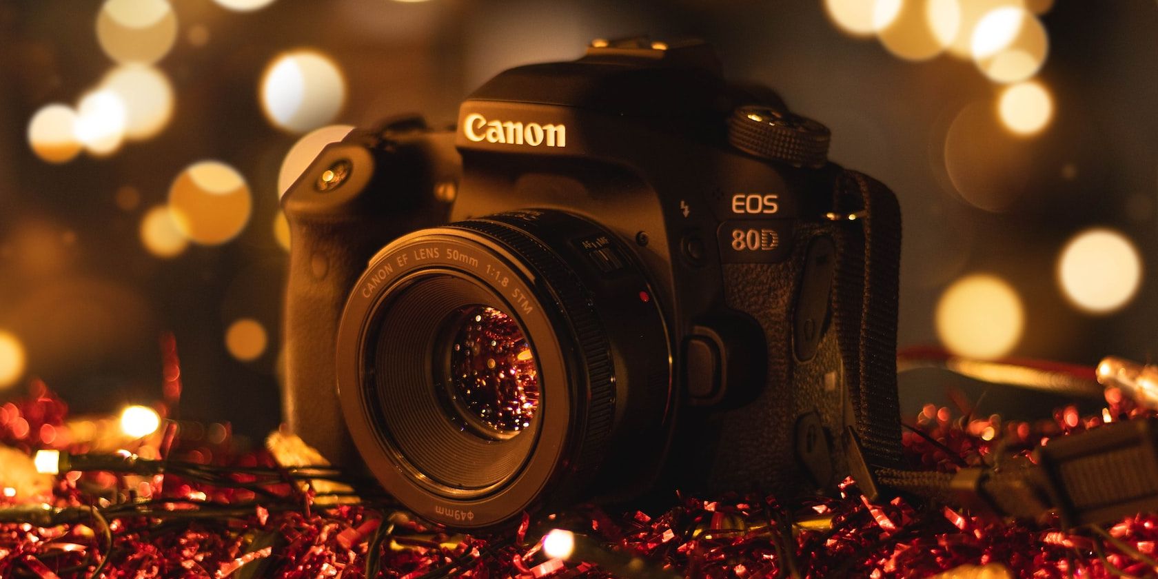 canon 80d on red ribbons with bokeh background