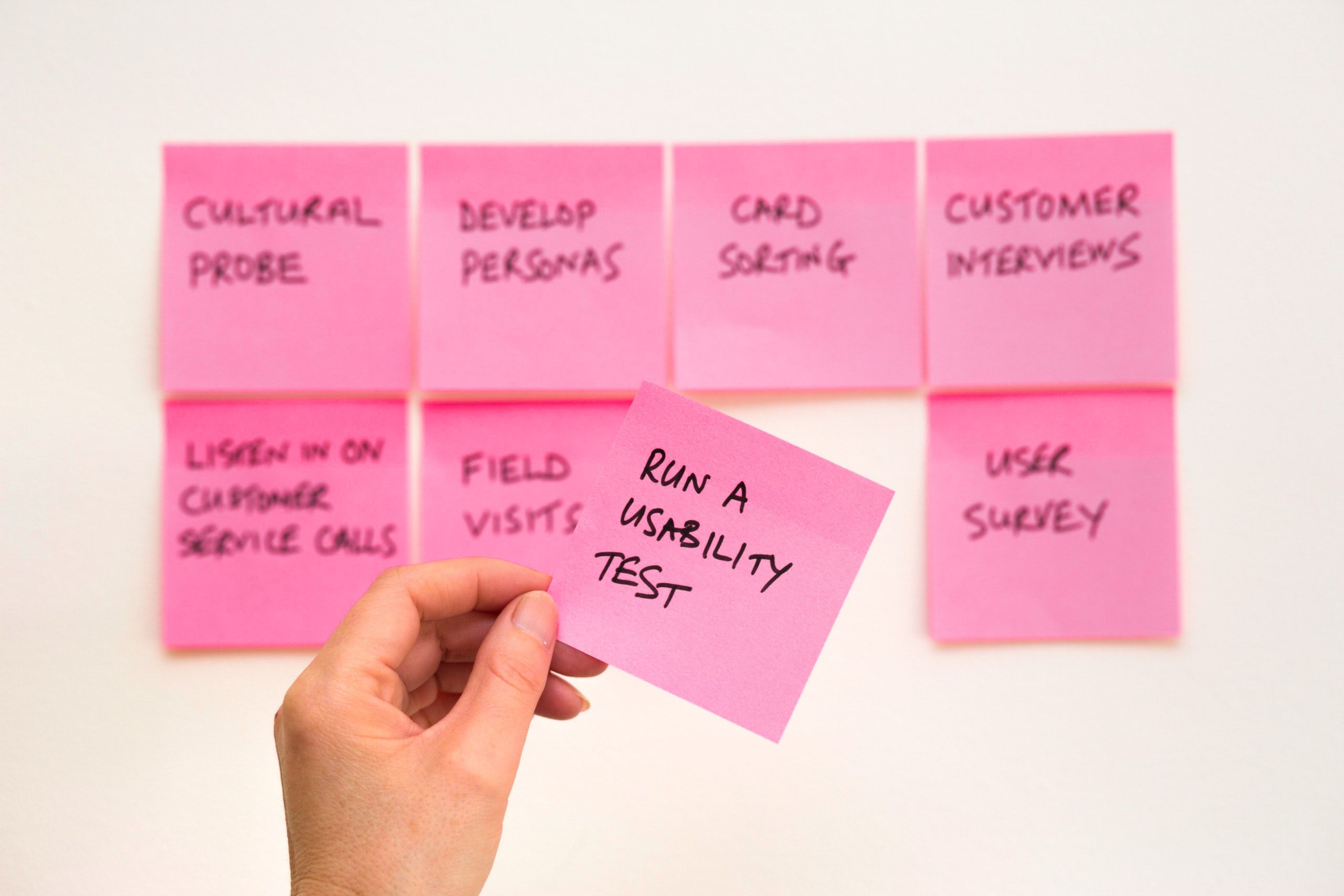 Pink sticky note with the text, run a usability test