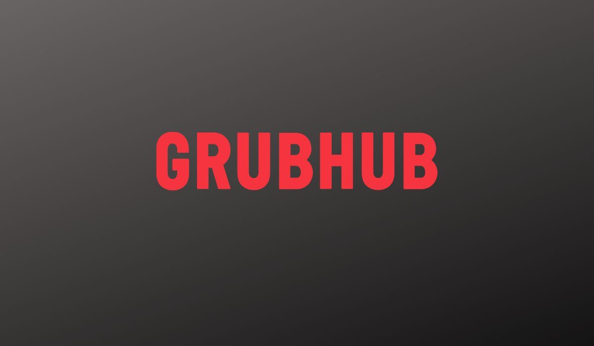 GrubHub's logo is seen on black background