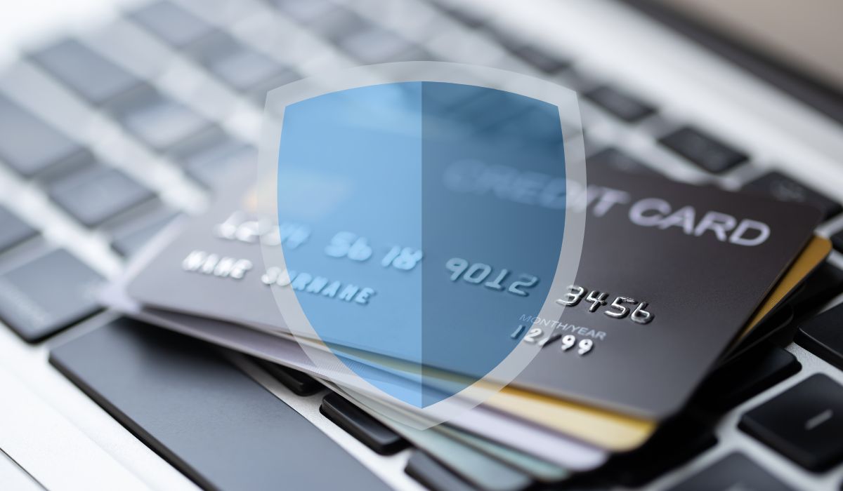 Blue shield seen over credit cards on a laptop keyboard