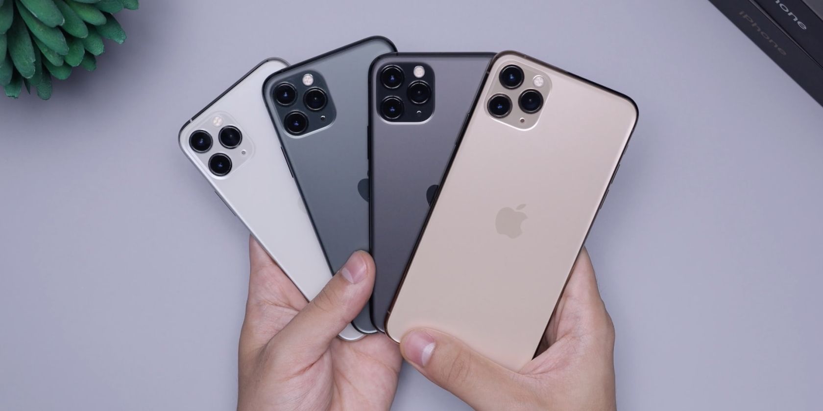 iPhone 12 Pro models in hand