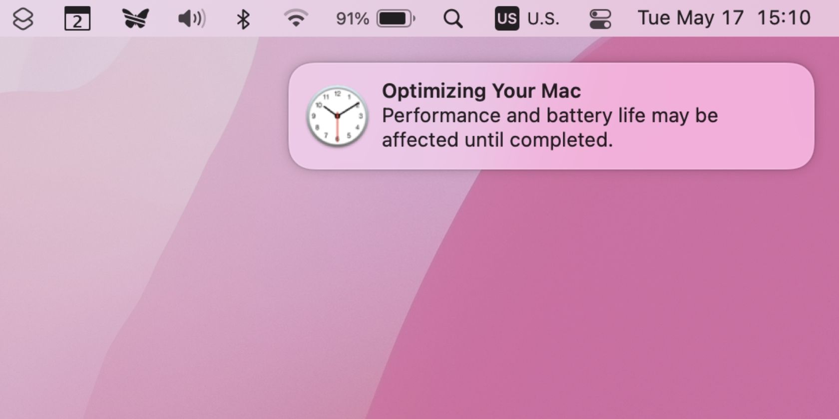 Notification informing the user that battery life and performance may be temporarily affected while macOS is optimizing the system