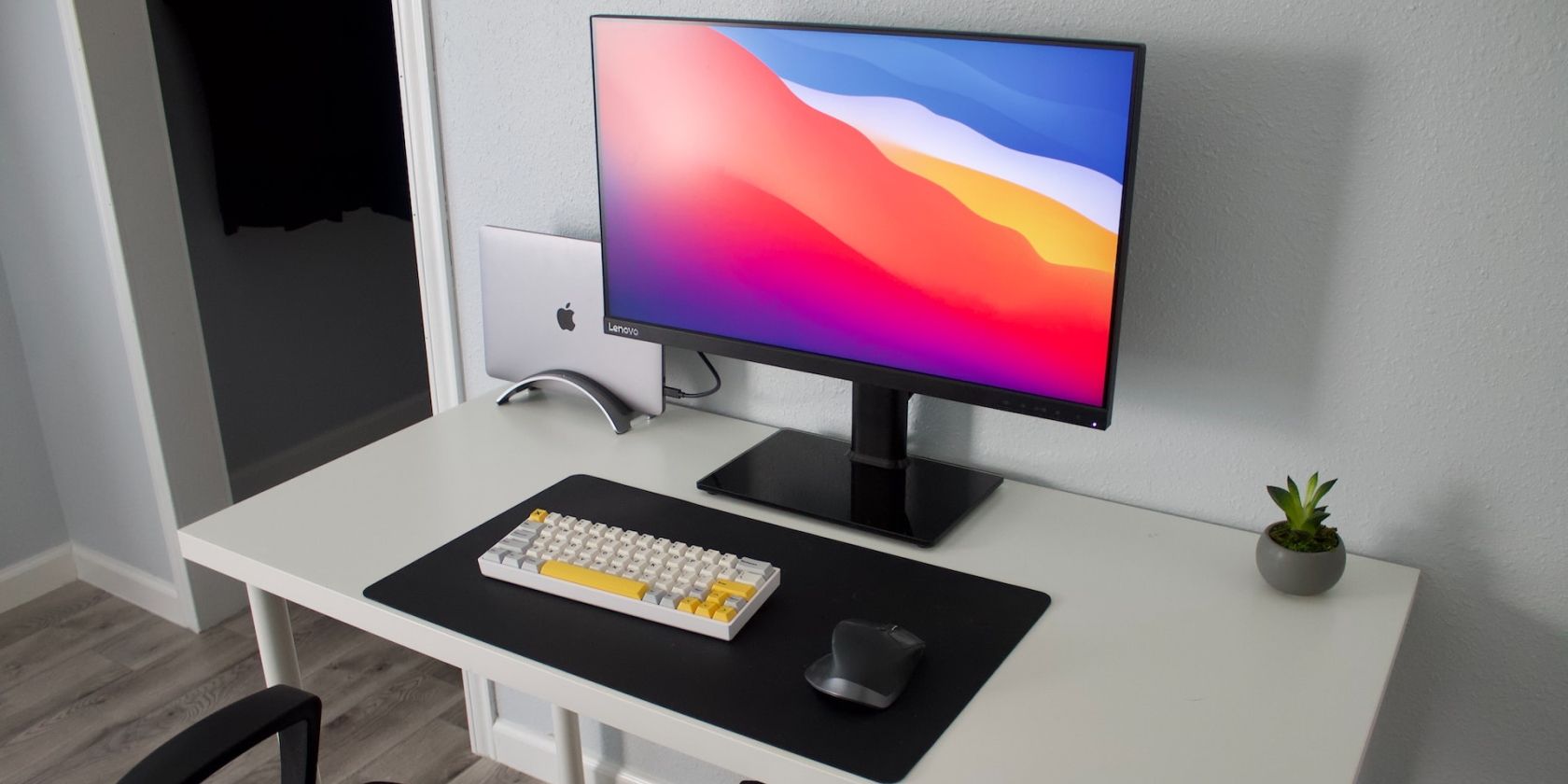 Logitech Mx mouse on a desk with a MacBook