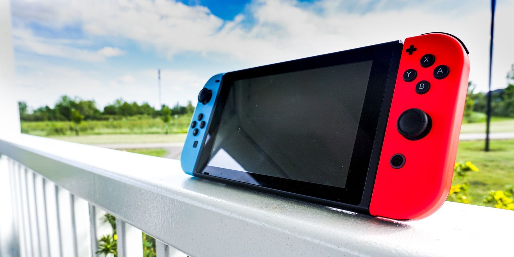A Nintendo Switch sitting propped up on a banister