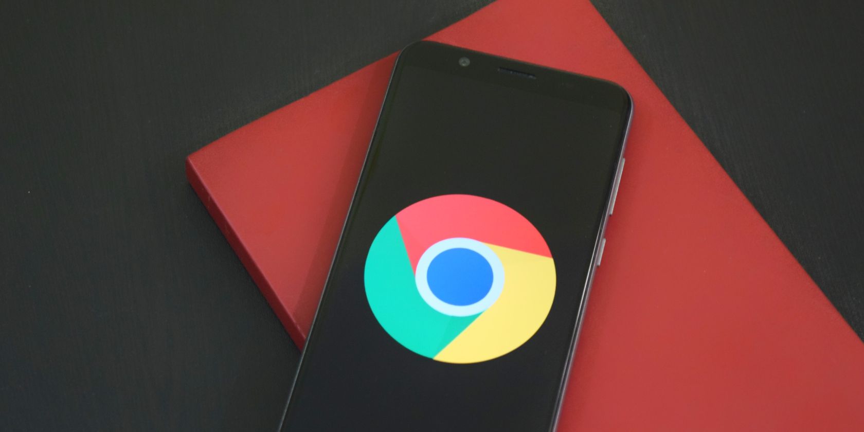 picture of a mobile phone with google chrome logo on screen