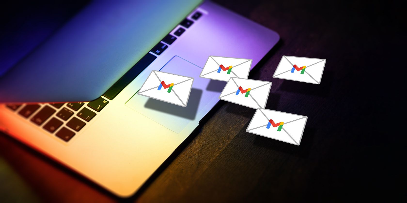 Envelopes with gmail logo flying out of laptop