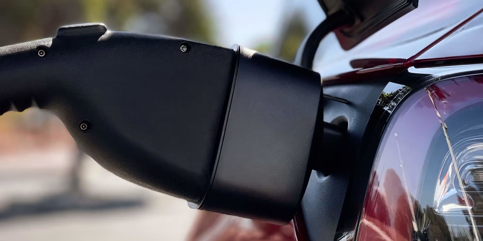 tesla ccs charger plugged into EV feature