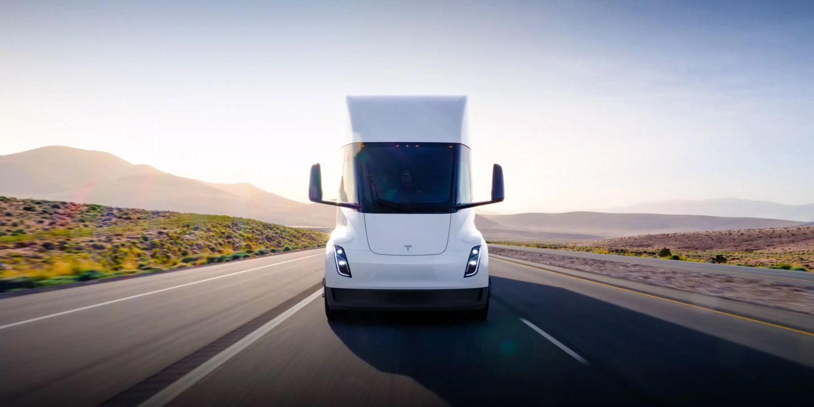 tesla semi front view driving on road feature