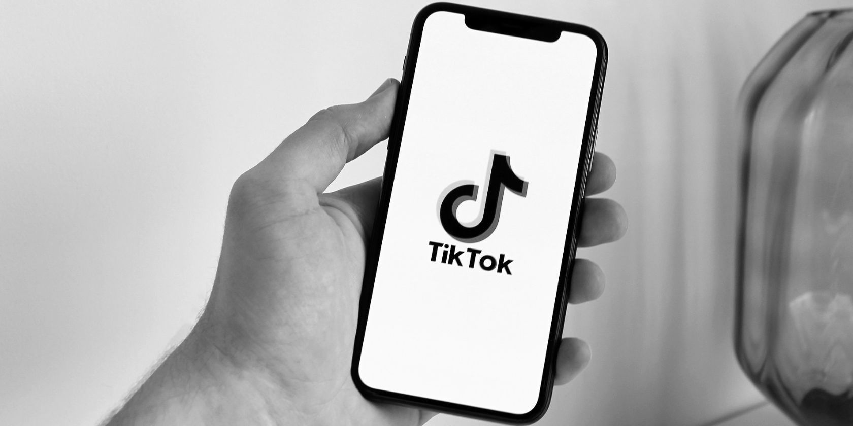 black and white photo of tiktok app on smartphone