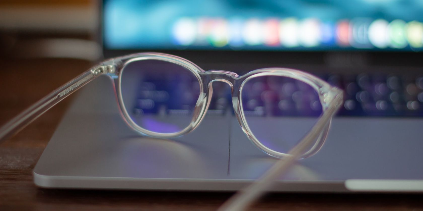 Transparent Eyeglasses Sitting on Laptop