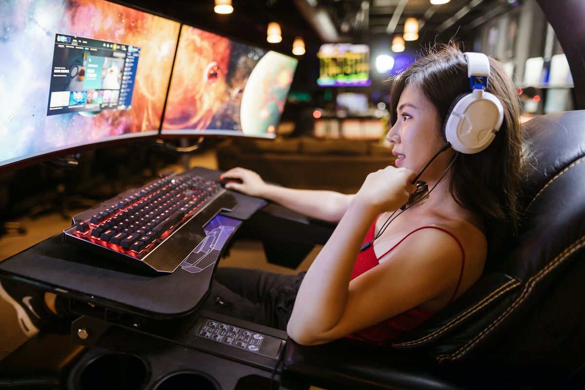 woman playing a game on PC