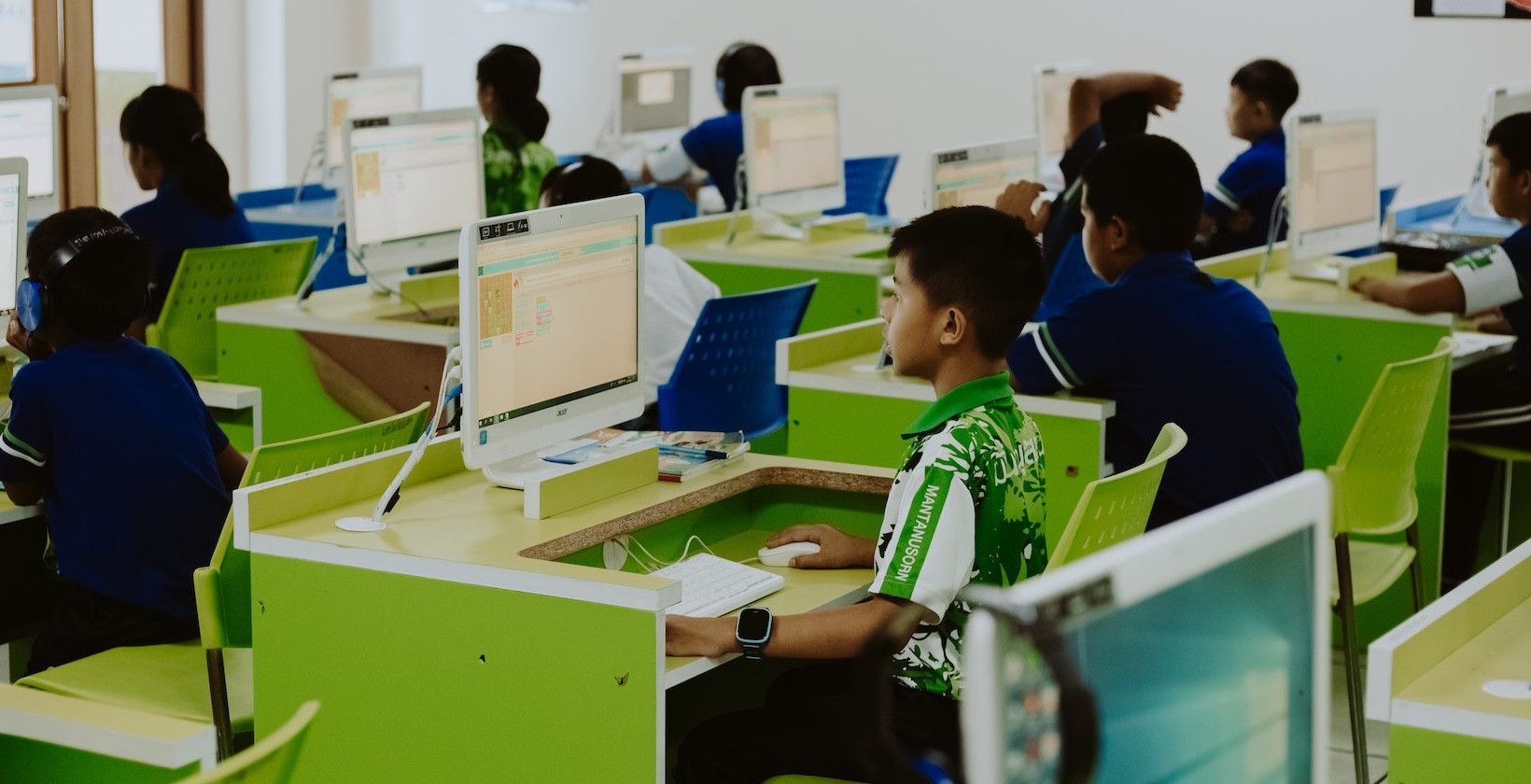 Photo of young students on computers