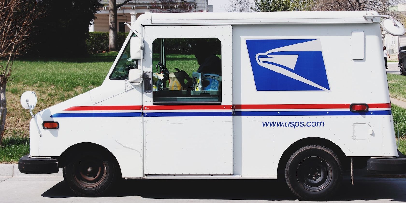 A USPS Van Standing on a Road