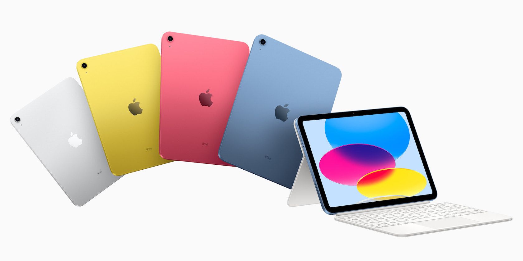 A fan of iPads in each backing color option against a white screen, with an open iPad and Smart Folio in front