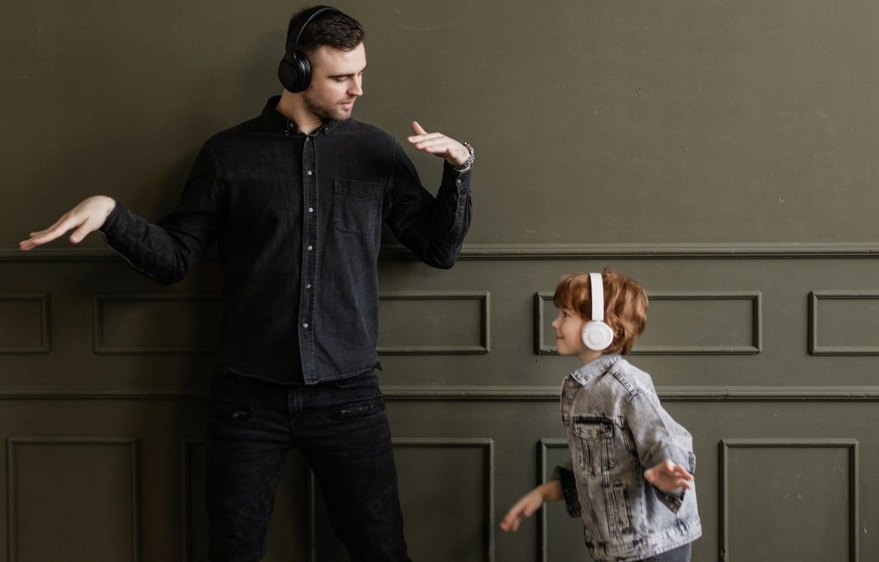 Father and Son Using Two Headphones with Bluetooth 5