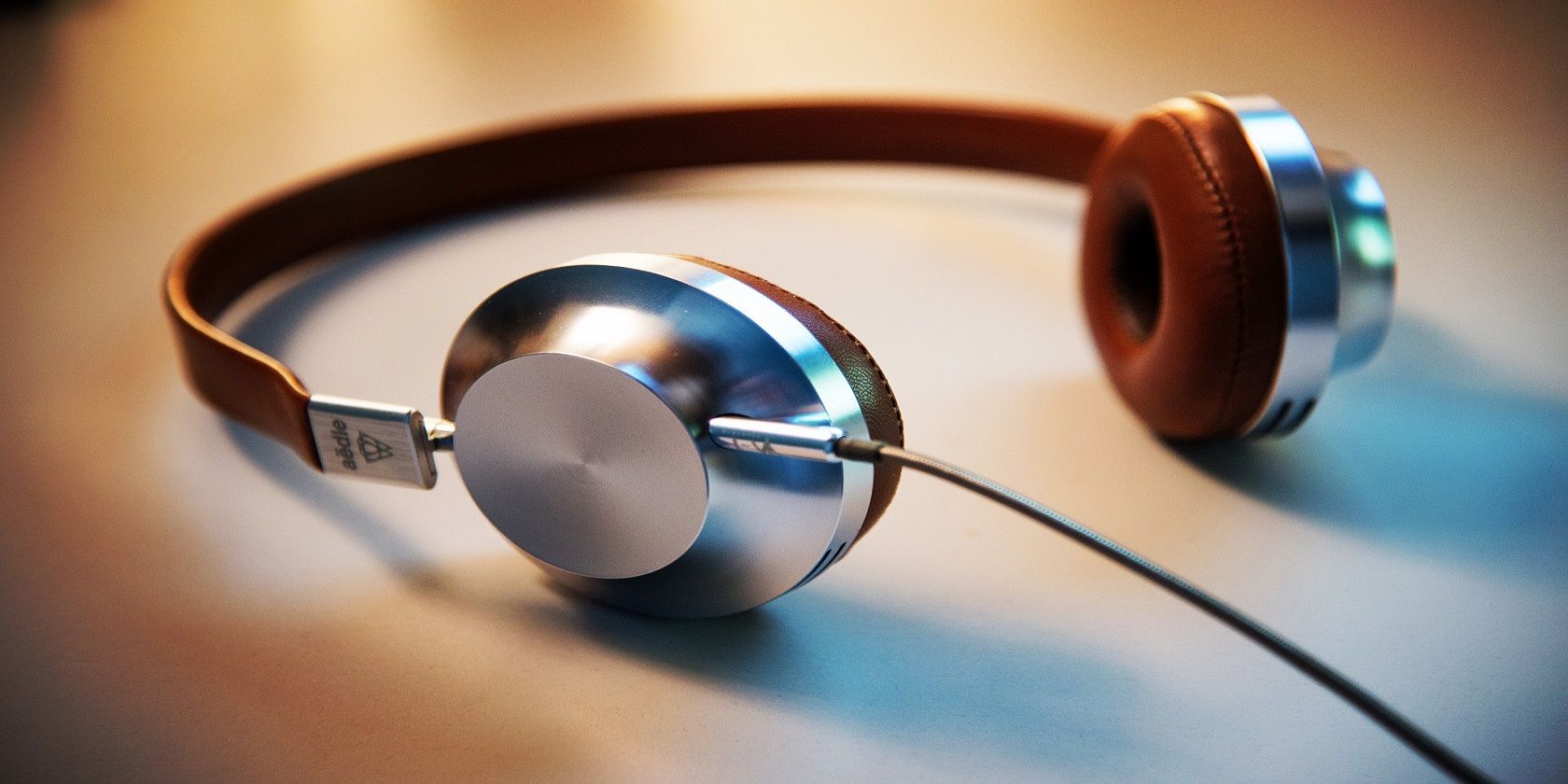 Headphones Laying on a Brown Background