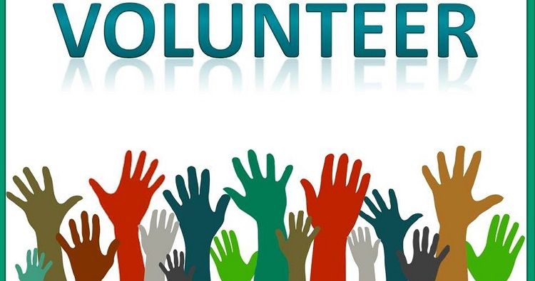 Image of the word volunteer with hands reach up