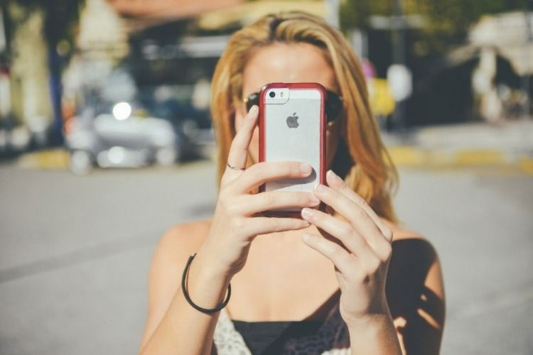 Girl looking at an iphone