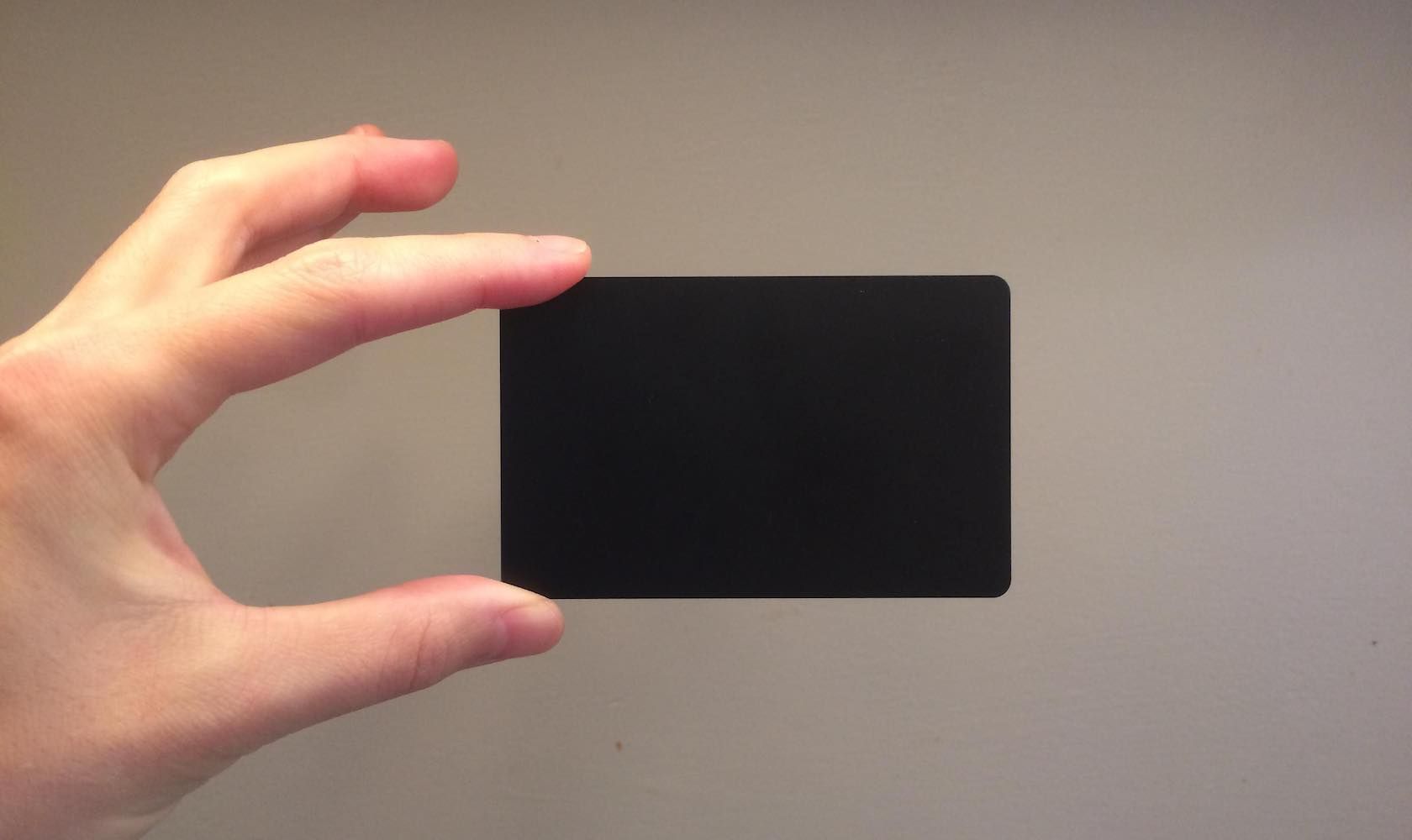 A black NFC card the size of a credit card.