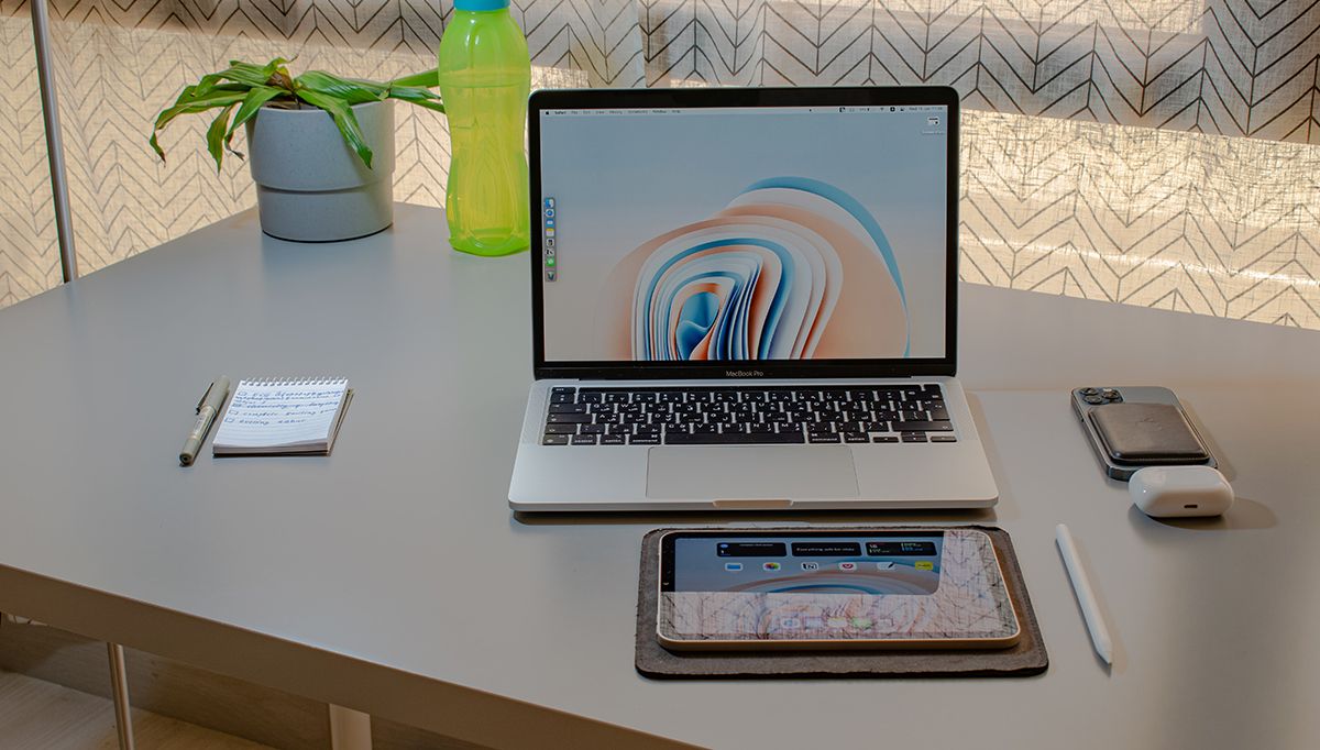 Apple Products Placed on a White Table