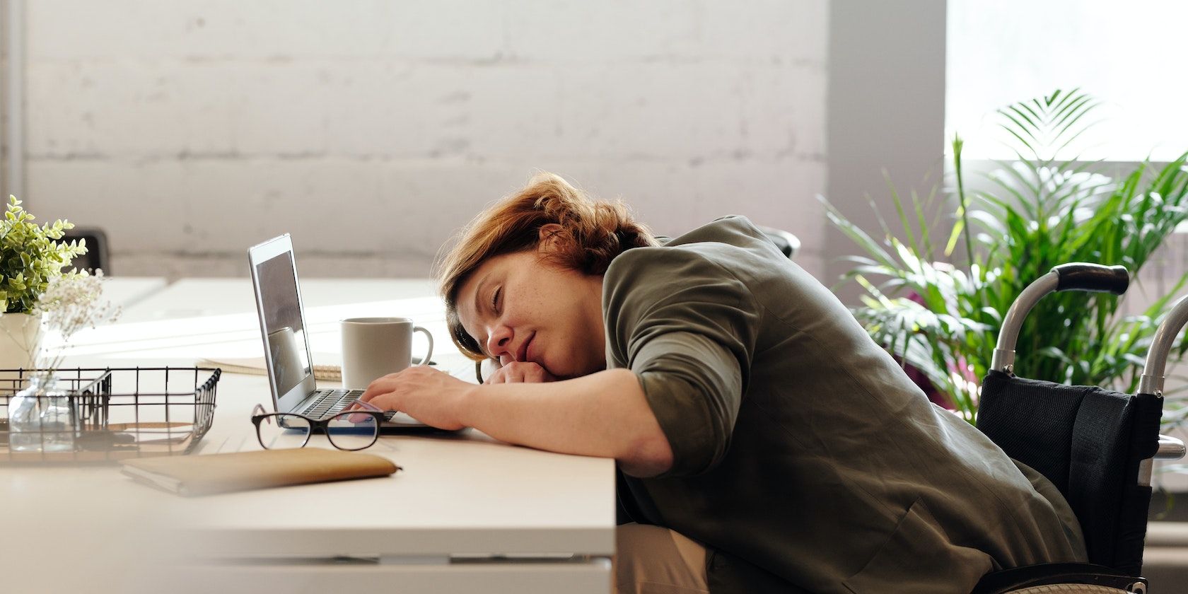 Woman Sleeping at Work Desk