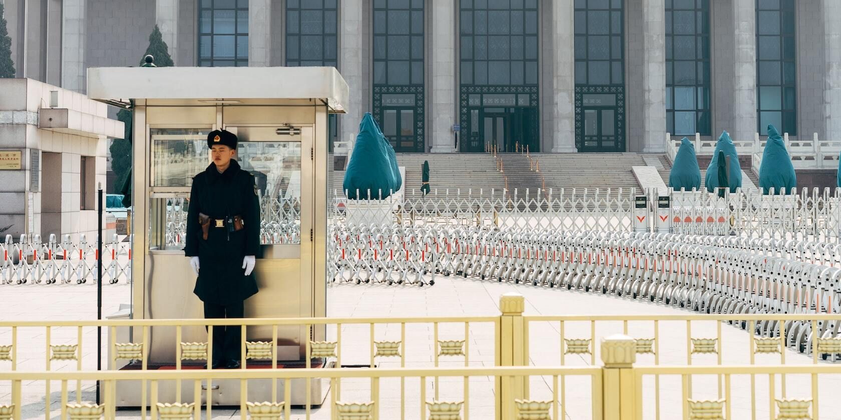 Guard stands outside a government agency in Beijing