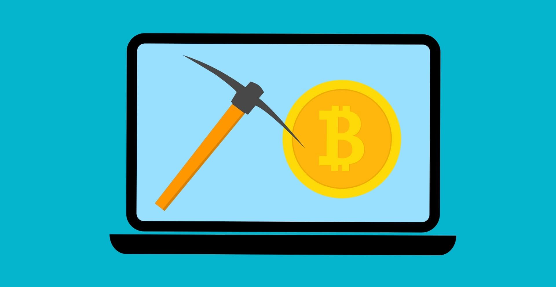 Bitcoin and pickaxe graphic on laptop screen