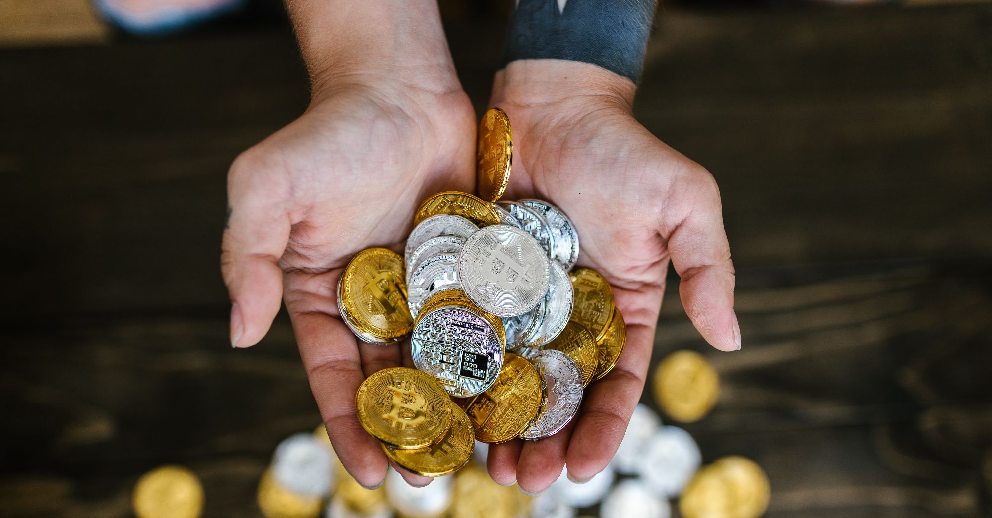 crypto coins being held in hands