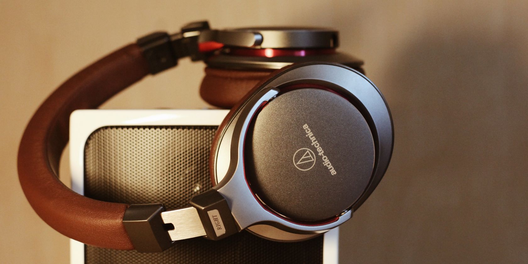 photo of a pair of headphones on speakers