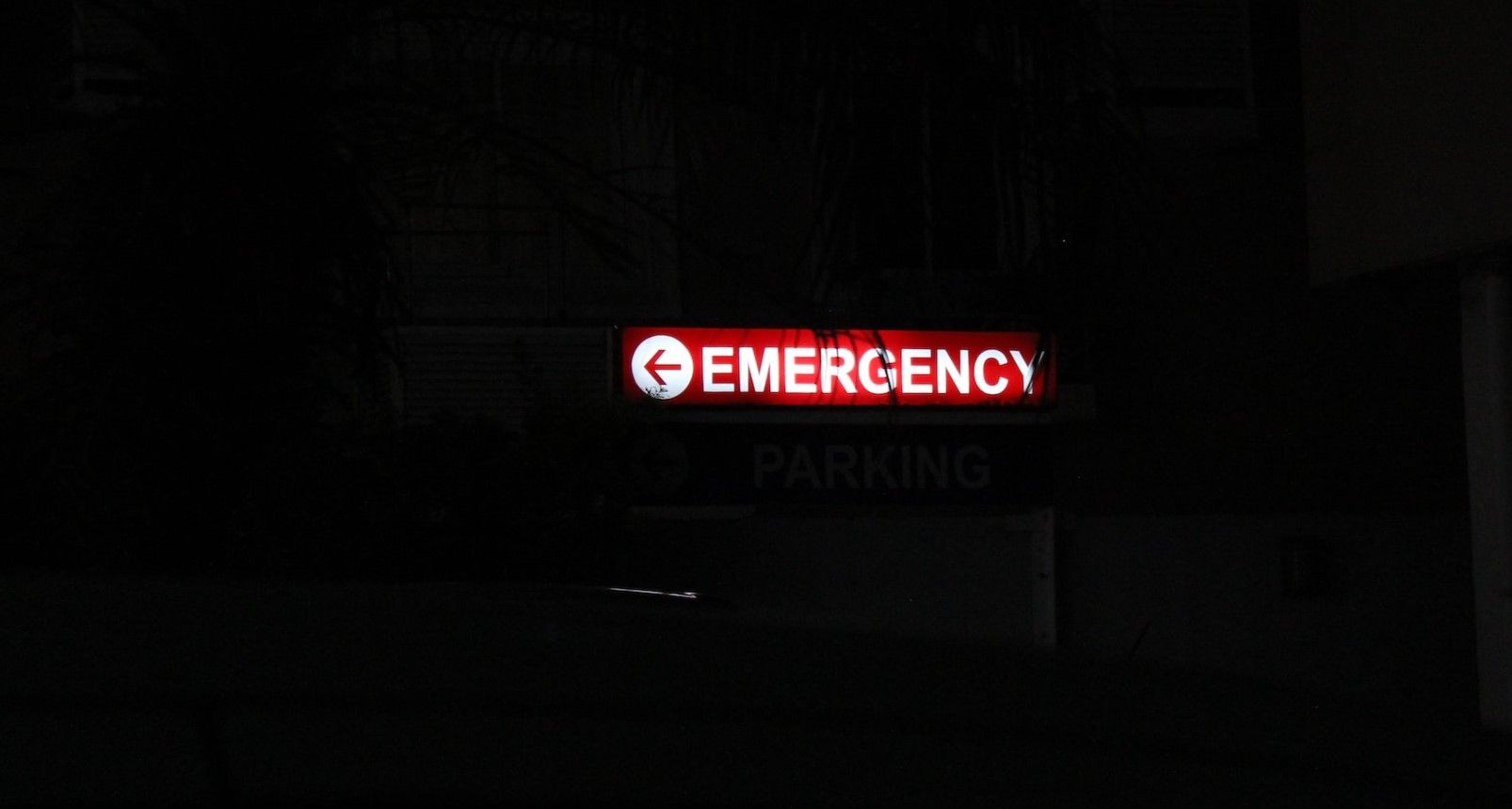 Photo of Neon Sign Saying Emergency 