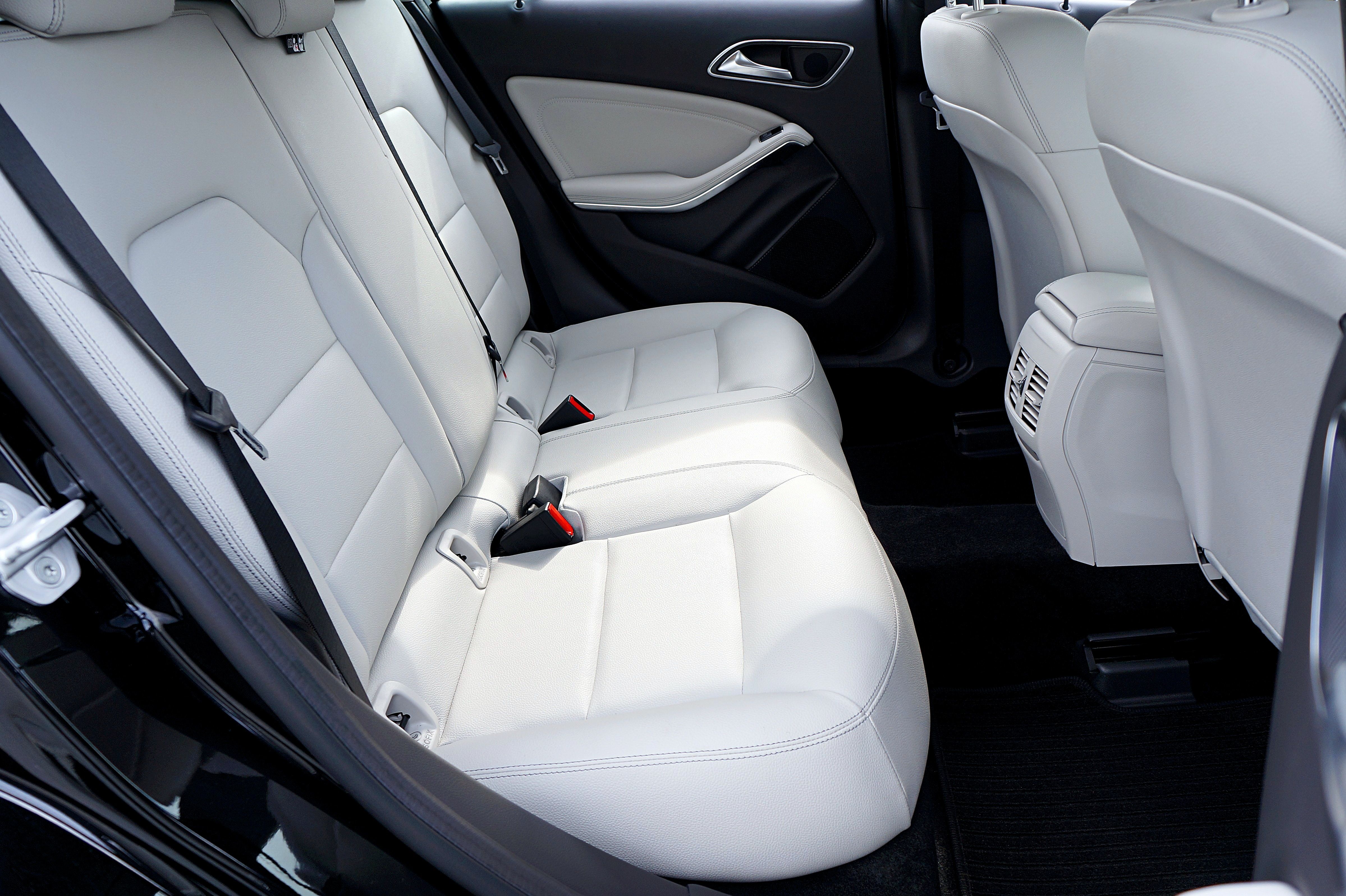 White synthetic leather rear seats in a sedan