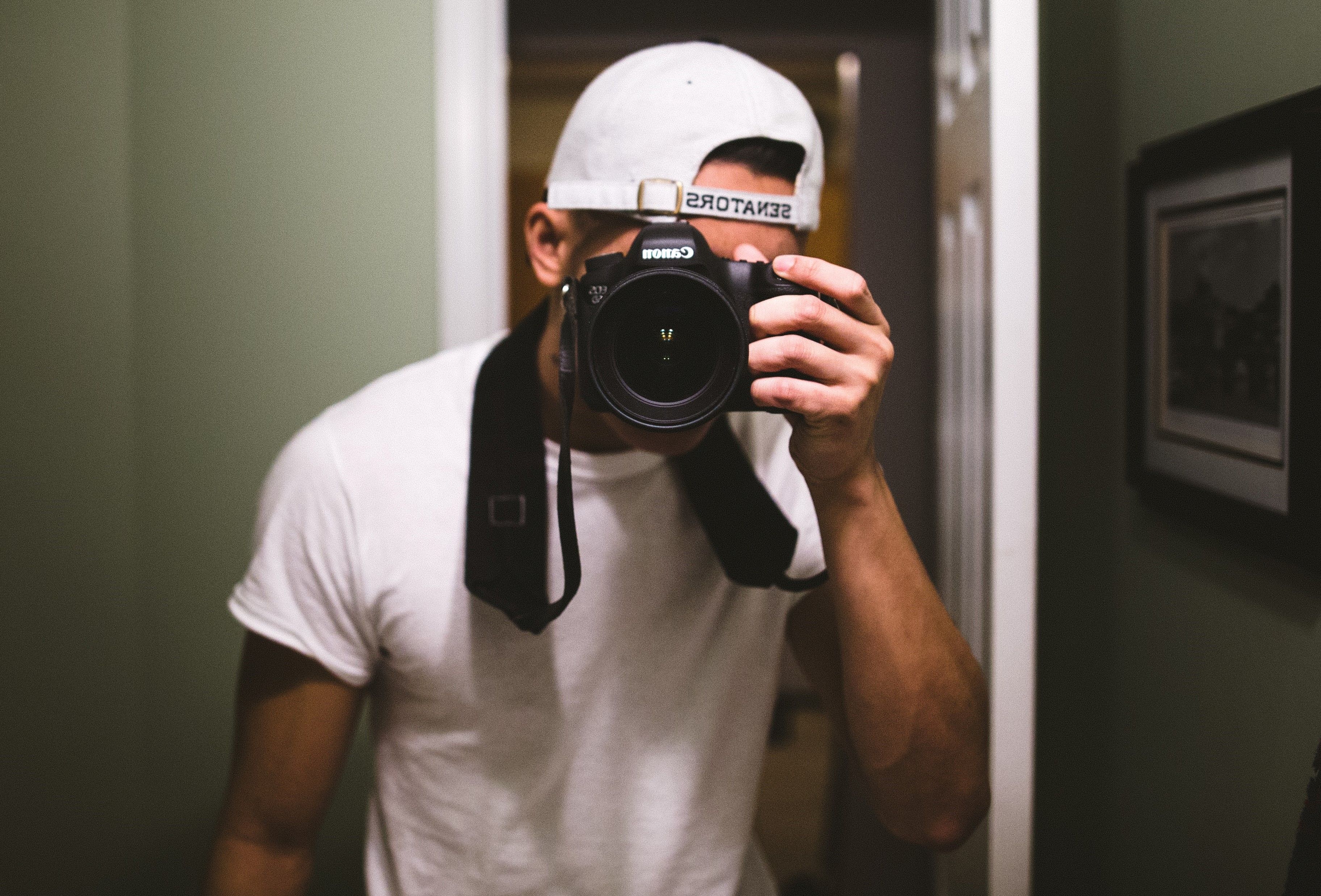 Man Taking Mirror Selfie With Camera