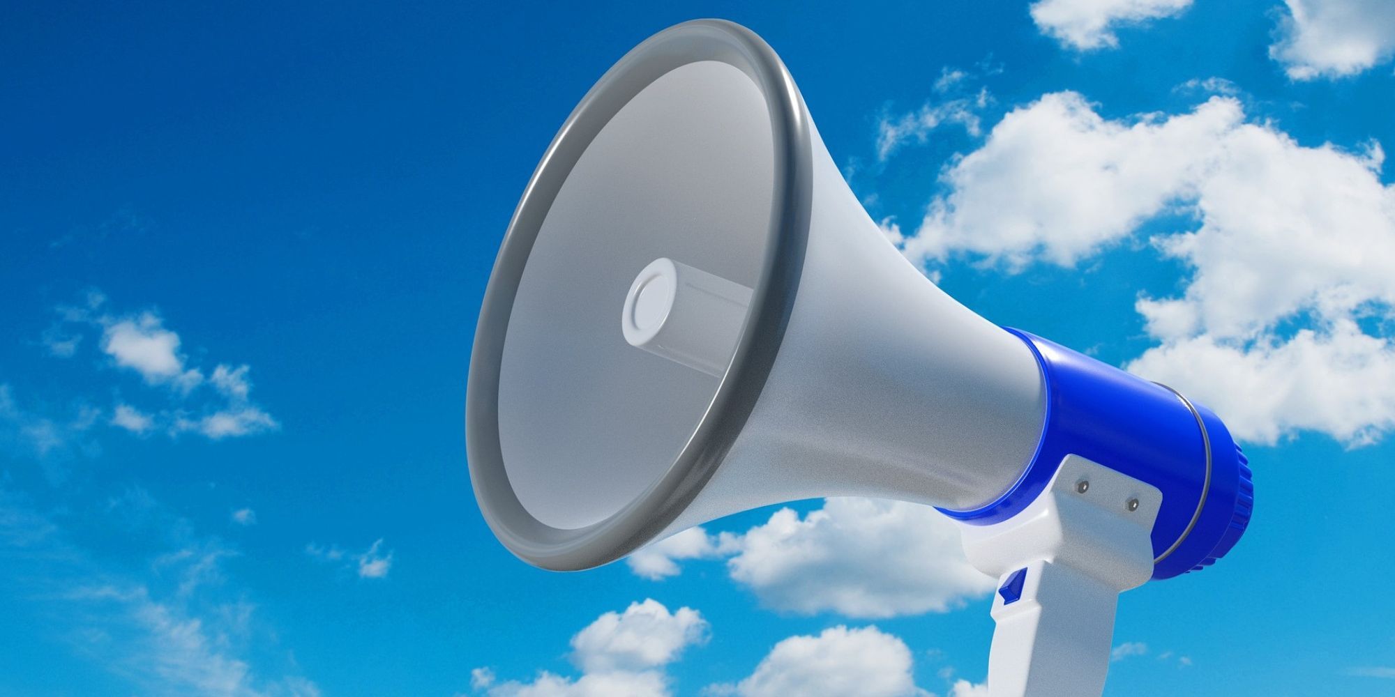 A megaphone with a blue sky background