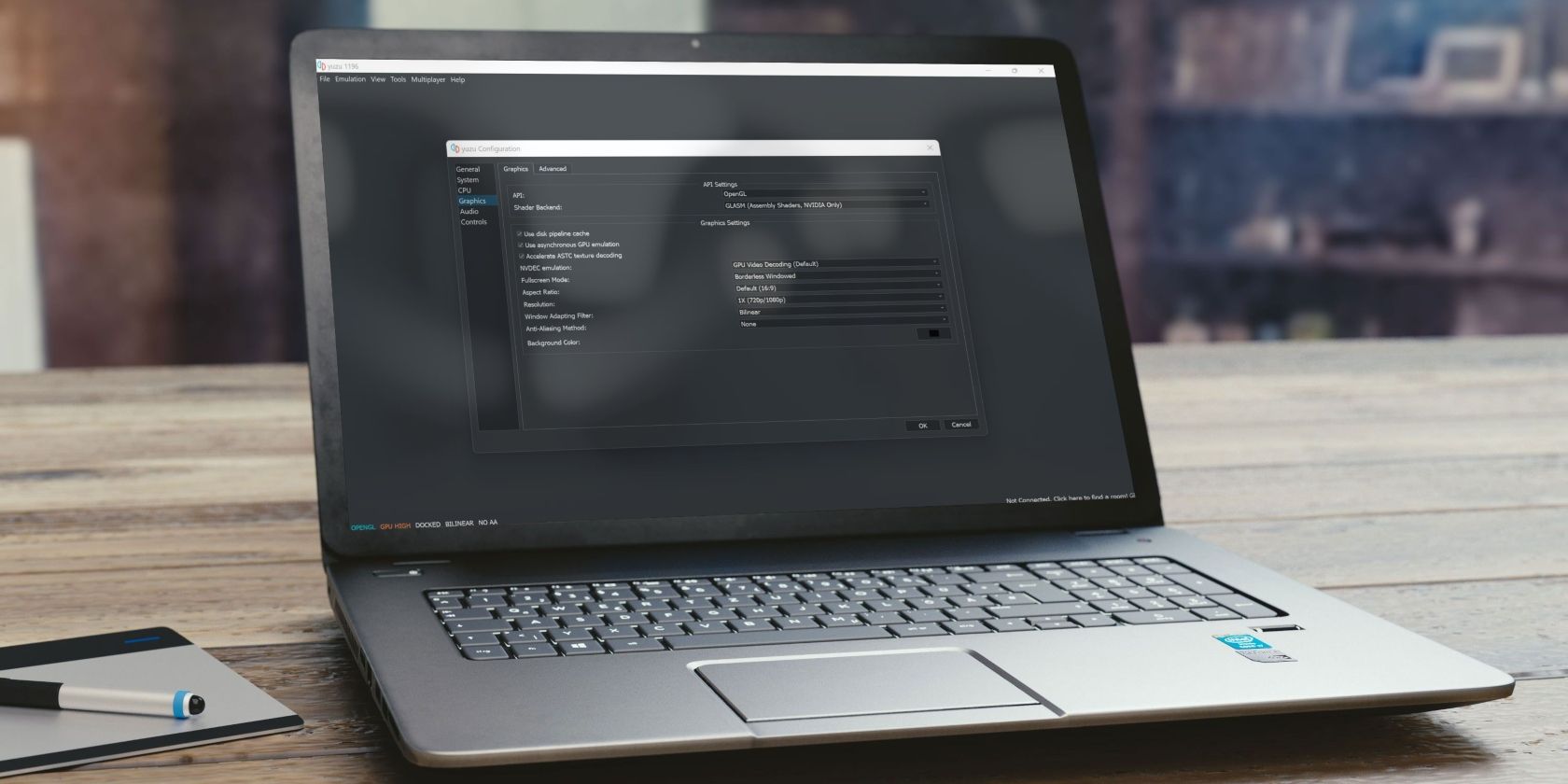 Laptop Placed on a Table Showing Yuzu Emulator App Running on Windows