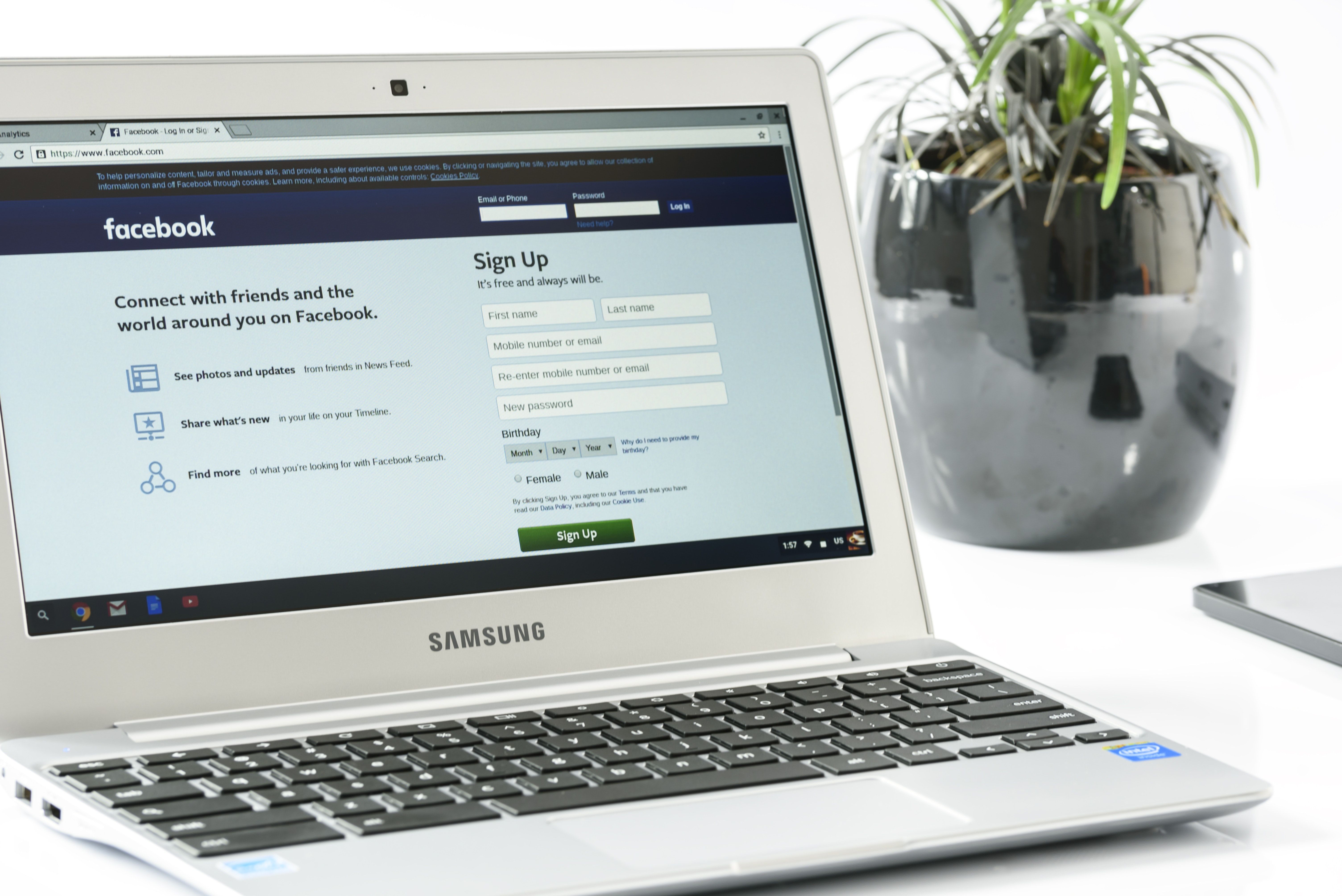 Open laptop showing Facebook's registration page