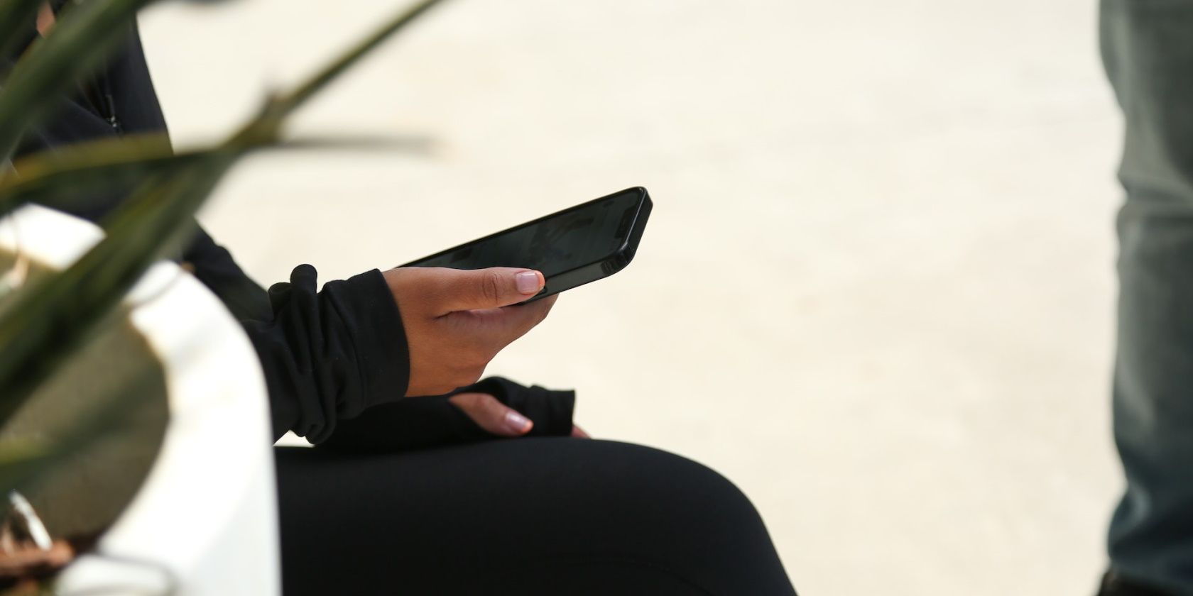 A hand holding a smartphone