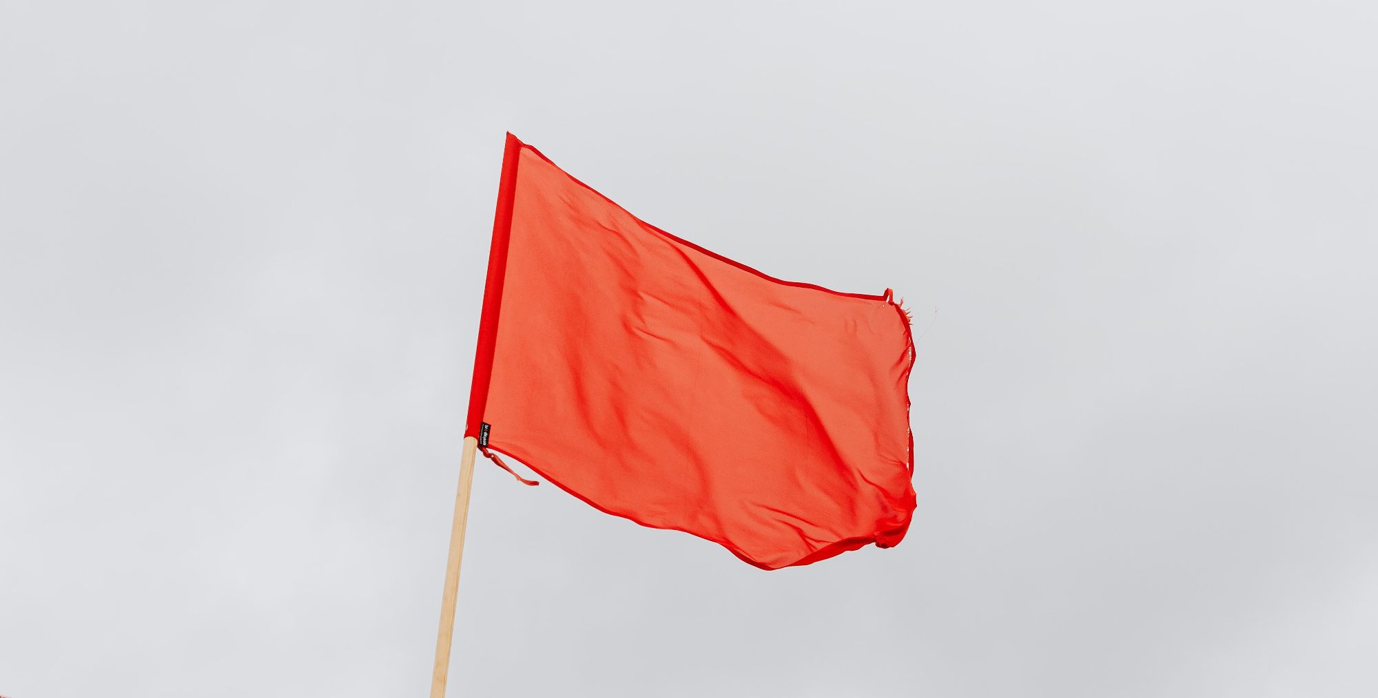 red flag blowing in wind