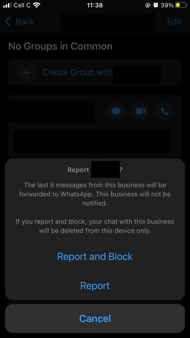 how to report a contact in whatsapp